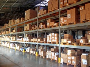 Warehouse Racks with protective shields on bottom rack