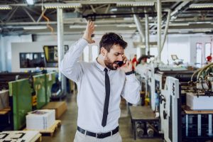 Picture of Plant Manager frustrated with lack of on time delivery from his sheet metal fabricator. He should have purchased his parts from Metalworking Solutions.