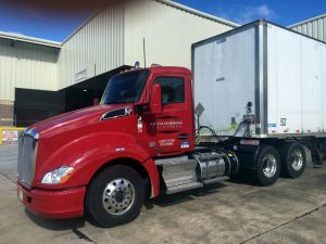 Semi-Tractor Metalworking Solutions backed up to the dock for loading