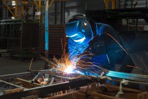Close up of an employee MIG Welding at Metalworking Solutions